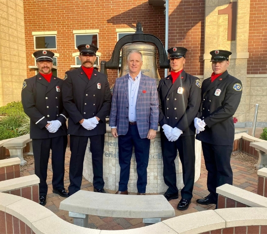 Brad Bailey stands with local law enforcement officers